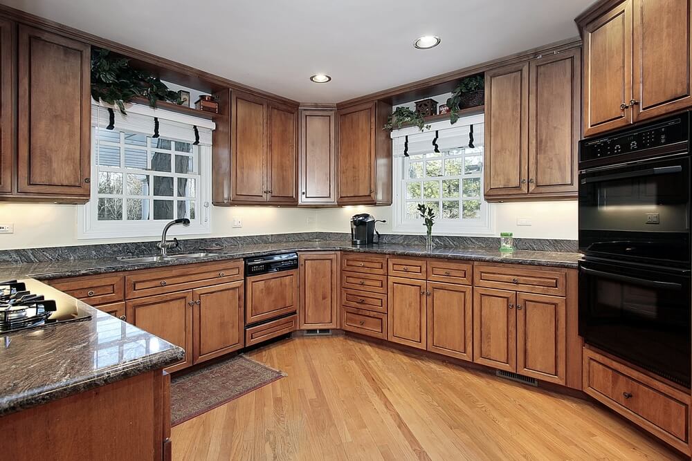 Kitchen with hickory cabinets and floor.